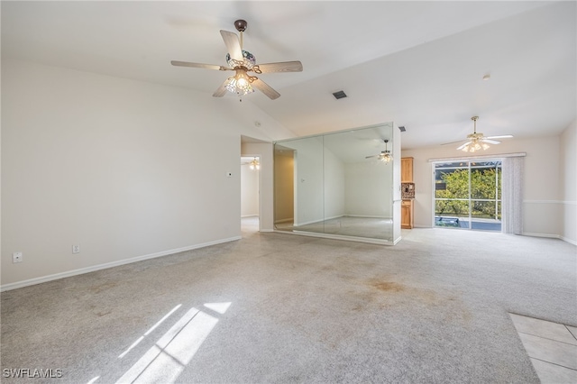 carpeted empty room featuring ceiling fan and vaulted ceiling