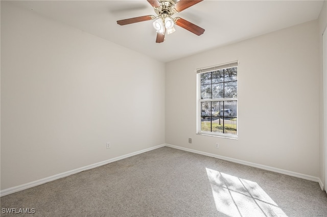 carpeted empty room with ceiling fan