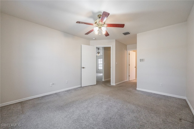 empty room featuring carpet and ceiling fan