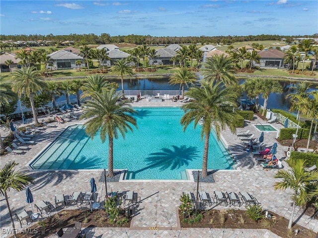 view of pool with a water view