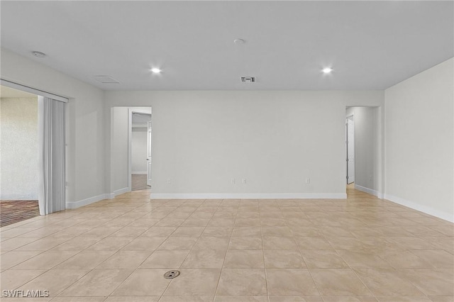 empty room with light tile patterned floors