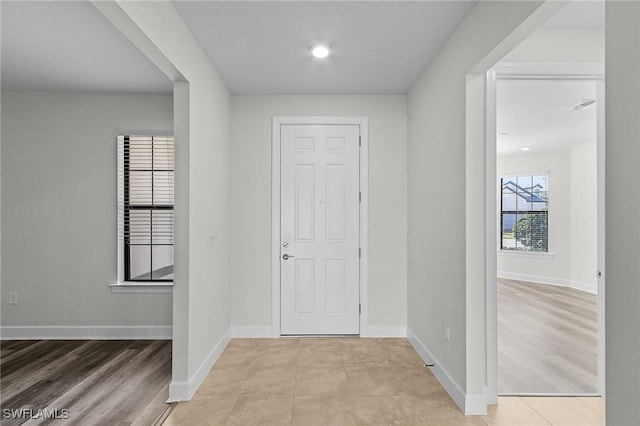 foyer with light hardwood / wood-style floors