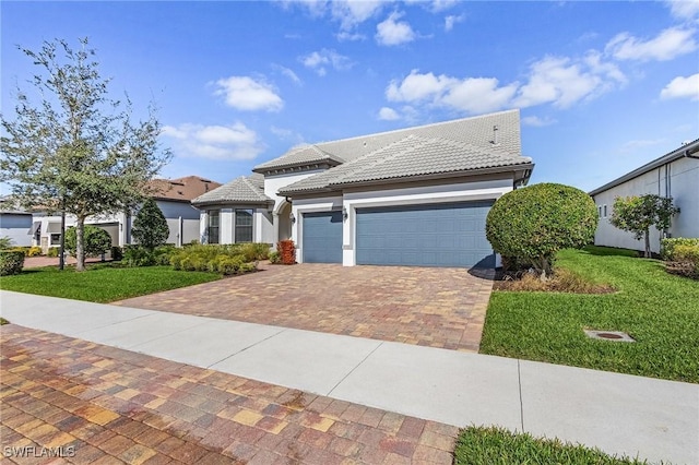 view of front of house featuring a front yard and a garage