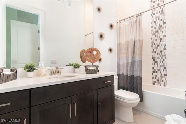 full bathroom featuring tile patterned floors, vanity, toilet, and shower / tub combo with curtain