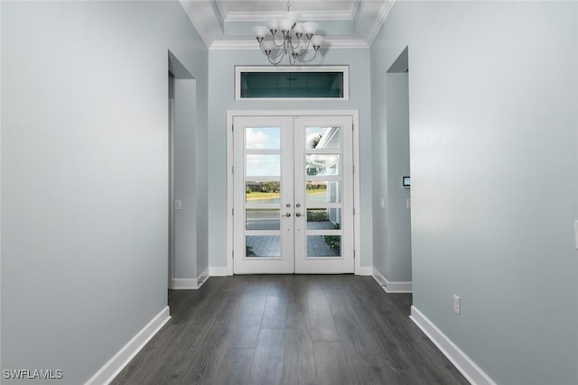 doorway with dark hardwood / wood-style flooring, crown molding, french doors, and a notable chandelier