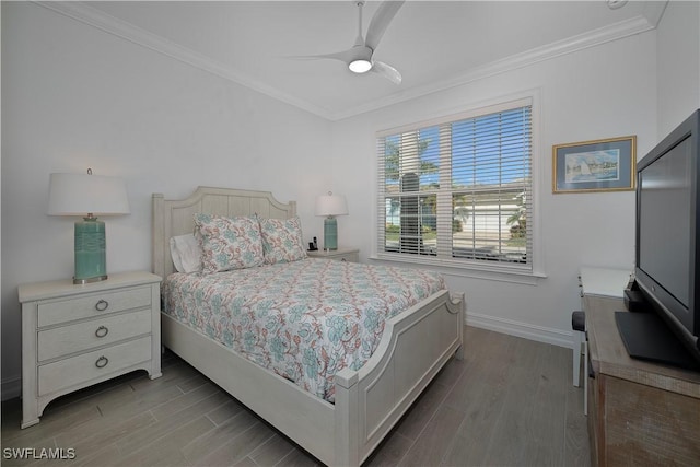 bedroom with hardwood / wood-style floors, ceiling fan, and crown molding