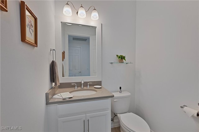 bathroom with vanity and toilet