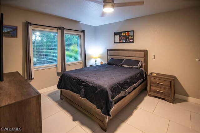 tiled bedroom with ceiling fan