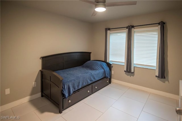 bedroom featuring ceiling fan and light tile patterned floors