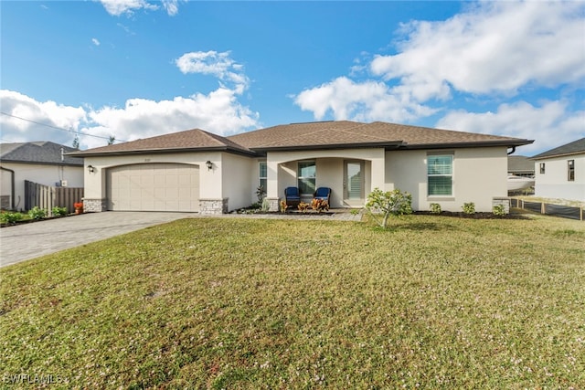 view of front of home featuring a garage and a front yard