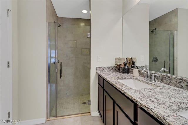 bathroom with vanity, tile patterned floors, and walk in shower