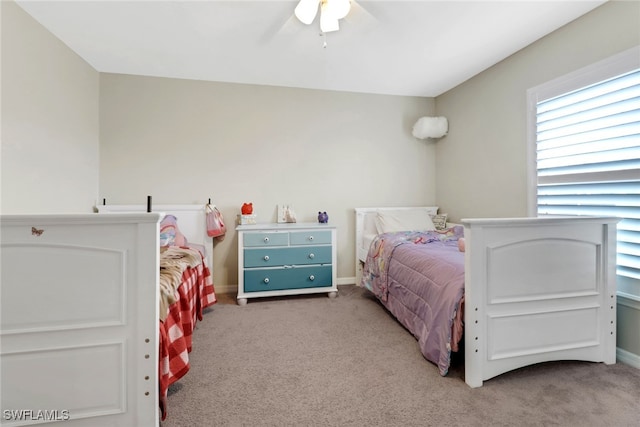 bedroom featuring ceiling fan and light carpet