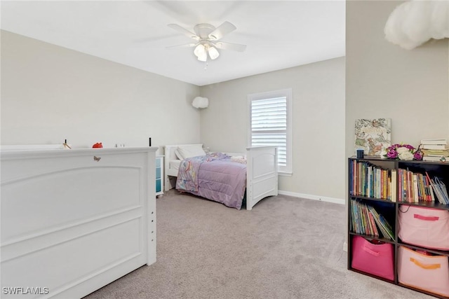 bedroom featuring ceiling fan and light carpet