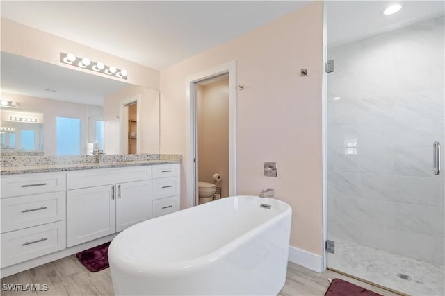 full bathroom with separate shower and tub, toilet, and wood-type flooring