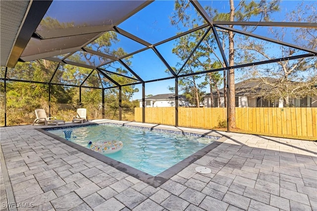 view of pool featuring a lanai and a patio area