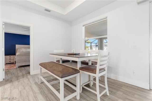 dining space featuring light wood-type flooring