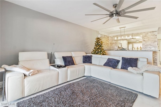 living room with light tile patterned floors and ceiling fan