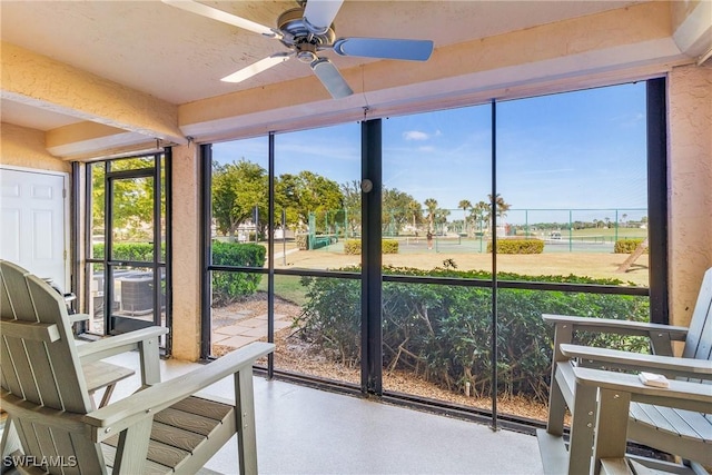 sunroom / solarium featuring ceiling fan