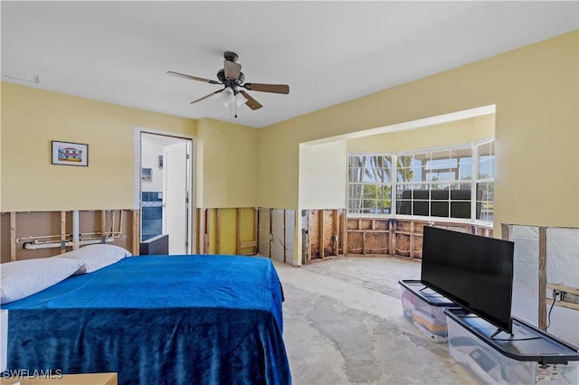 bedroom featuring ceiling fan and concrete flooring