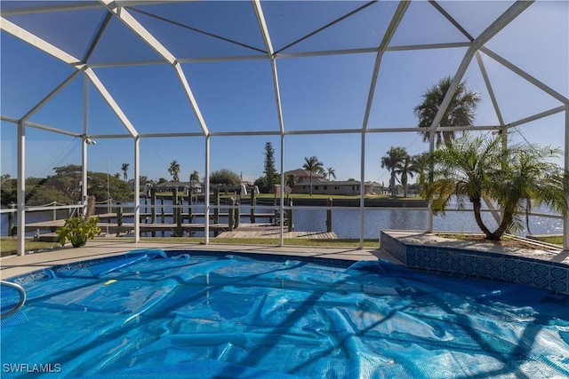 view of pool featuring a lanai and a water view