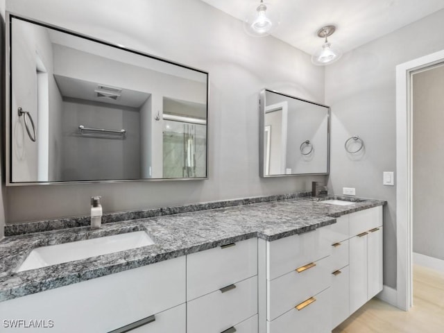 bathroom featuring vanity and wood-type flooring