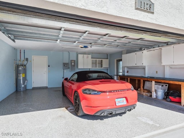 garage with electric panel, water heater, and a garage door opener