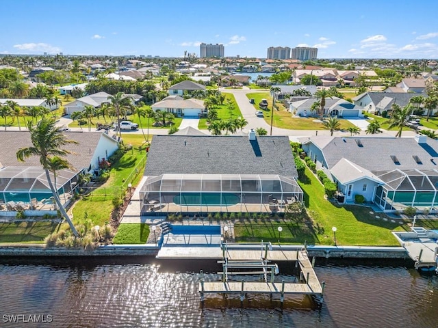 birds eye view of property featuring a water view