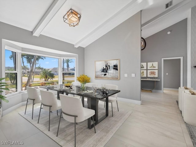 dining room with beamed ceiling, light tile patterned flooring, and high vaulted ceiling