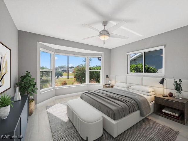 bedroom featuring ceiling fan and light tile patterned flooring