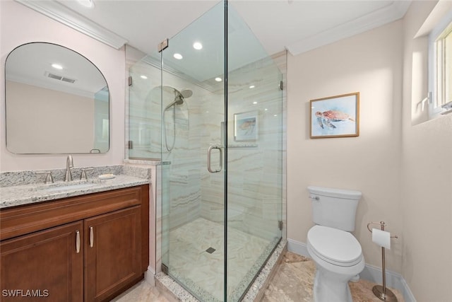 bathroom featuring vanity, a shower with shower door, ornamental molding, and toilet