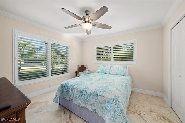 bedroom with a ceiling fan, baseboards, a closet, and ornamental molding