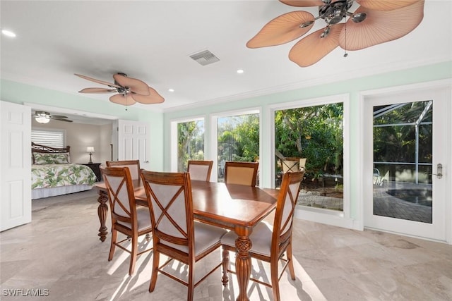 sunroom / solarium featuring ceiling fan