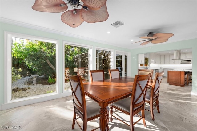 sunroom with ceiling fan and visible vents