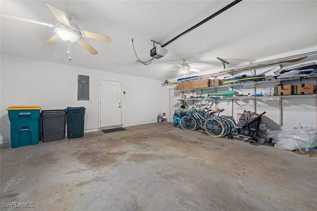 garage featuring a garage door opener and electric panel