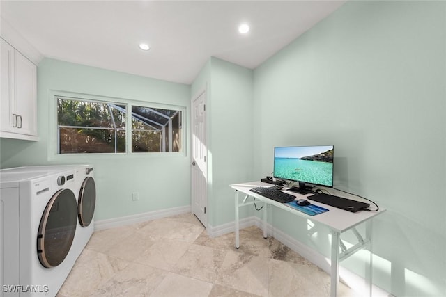 laundry area featuring baseboards, washer and dryer, and recessed lighting