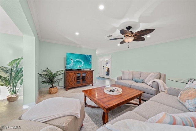 living room featuring ornamental molding, recessed lighting, visible vents, and baseboards