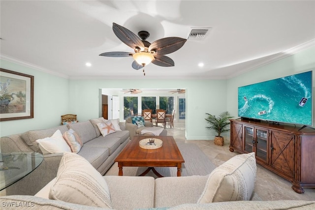 living area featuring baseboards, visible vents, and crown molding