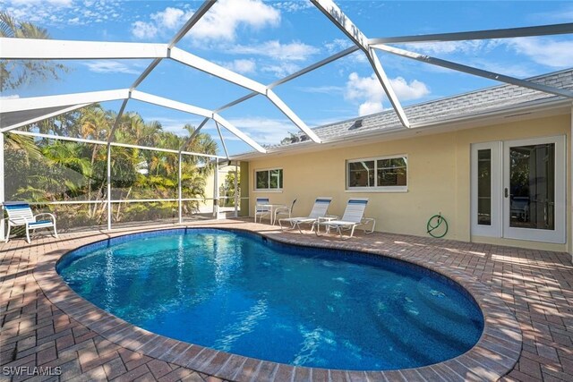 view of pool featuring a lanai and a patio area