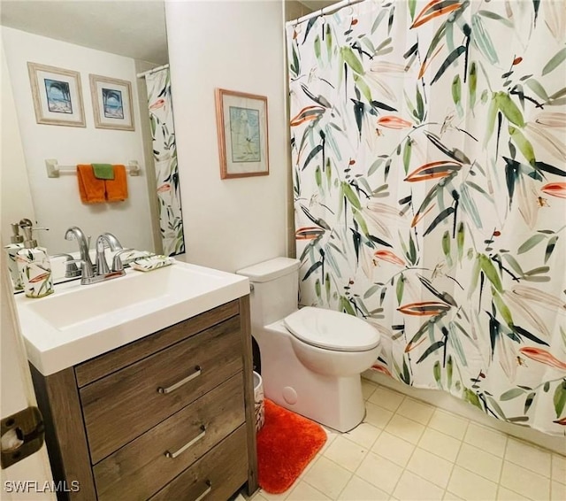 bathroom with tile patterned floors, vanity, toilet, and a shower with curtain