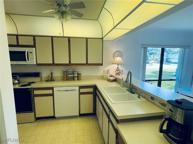 kitchen with ceiling fan, sink, and white appliances