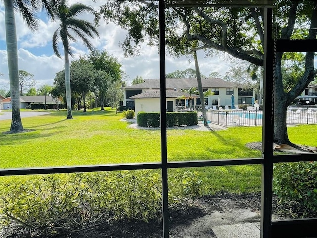 view of yard with a community pool