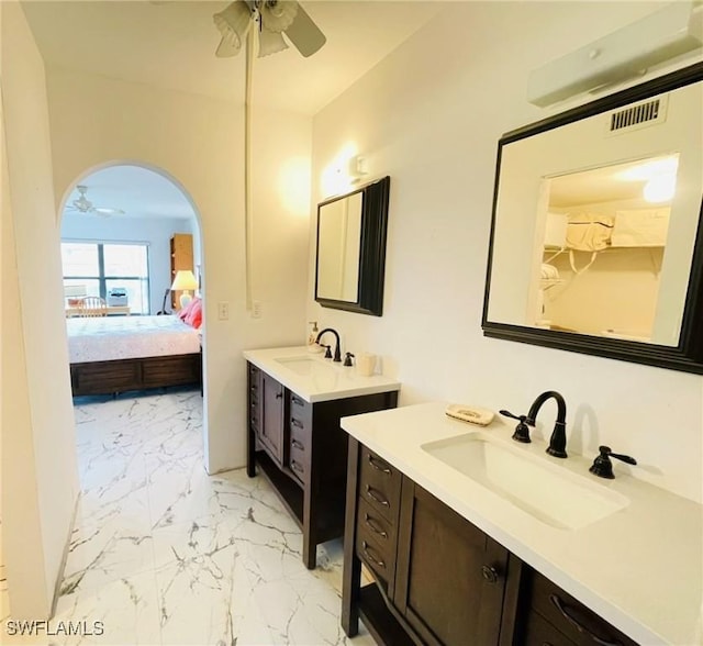 bathroom featuring vanity and ceiling fan