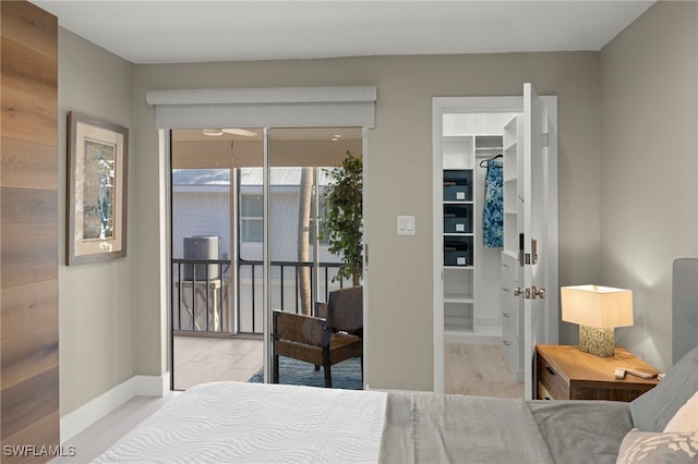 bedroom featuring light hardwood / wood-style floors and access to outside