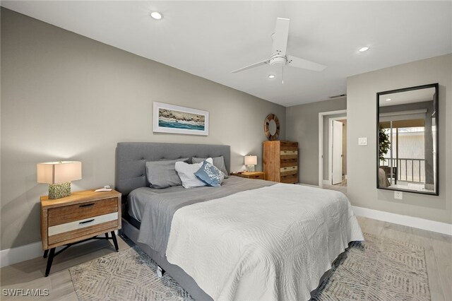 bedroom with ceiling fan and light hardwood / wood-style flooring