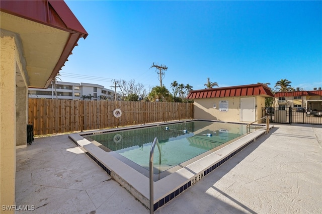 view of swimming pool with a patio area