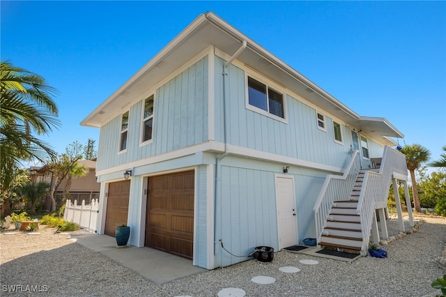 view of side of property featuring a garage