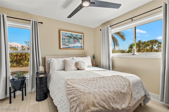 bedroom featuring light hardwood / wood-style floors and ceiling fan