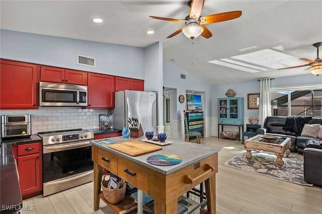 kitchen featuring tasteful backsplash, high vaulted ceiling, ceiling fan, stainless steel appliances, and light hardwood / wood-style floors