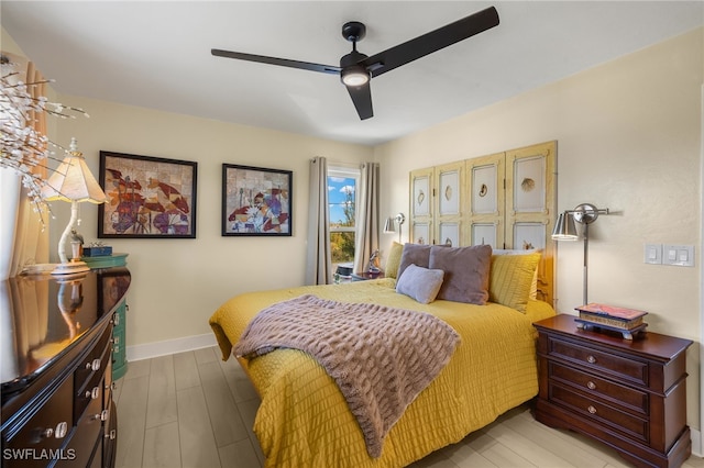 bedroom featuring ceiling fan and light hardwood / wood-style flooring