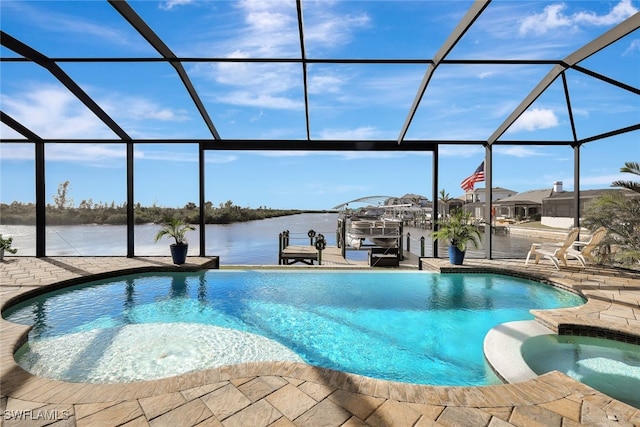 view of swimming pool featuring glass enclosure, a patio area, a water view, and an in ground hot tub